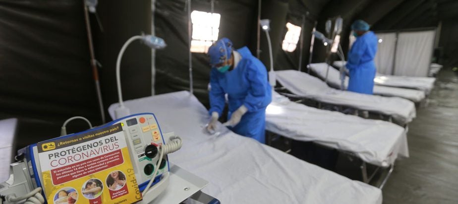 nurses prepare hospital beds