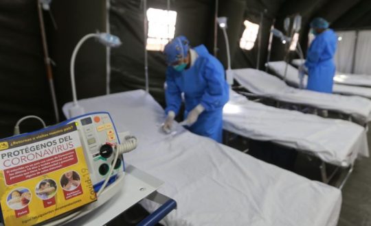 nurses prepare hospital beds