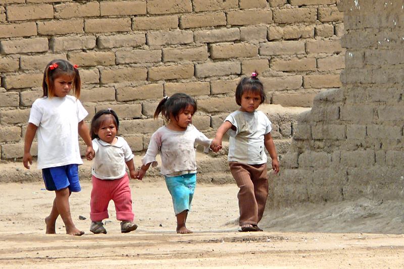 four little girls walking hand in hand