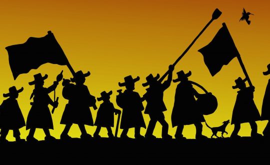 silhouette of a parade by rural Andean people