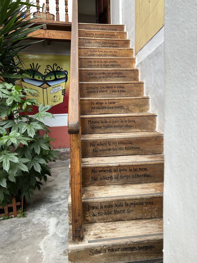 a wooden staircase with writing on each step