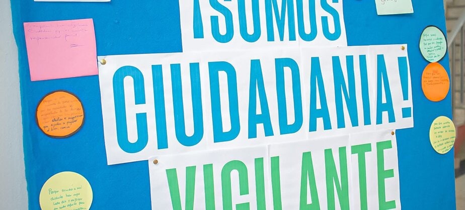 a sign reads "We are watchful citizens"