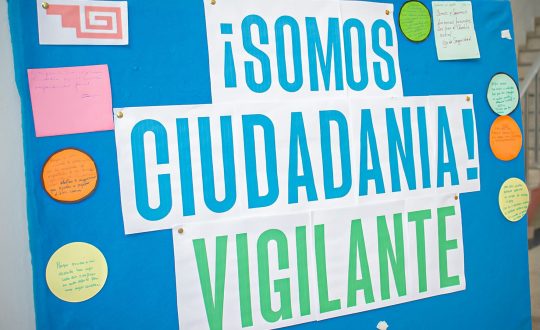 a sign reads "We are watchful citizens"